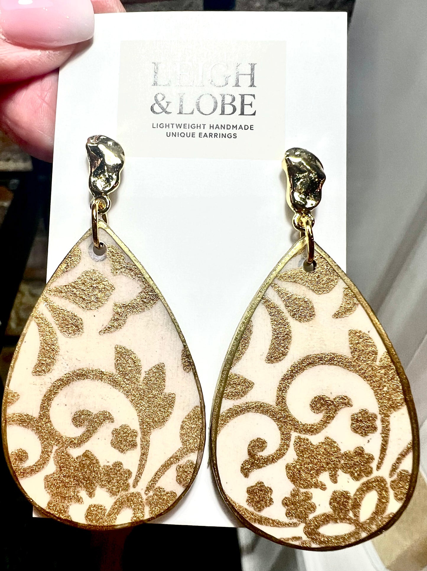 Tear drop cream and gold design with gold hardware 