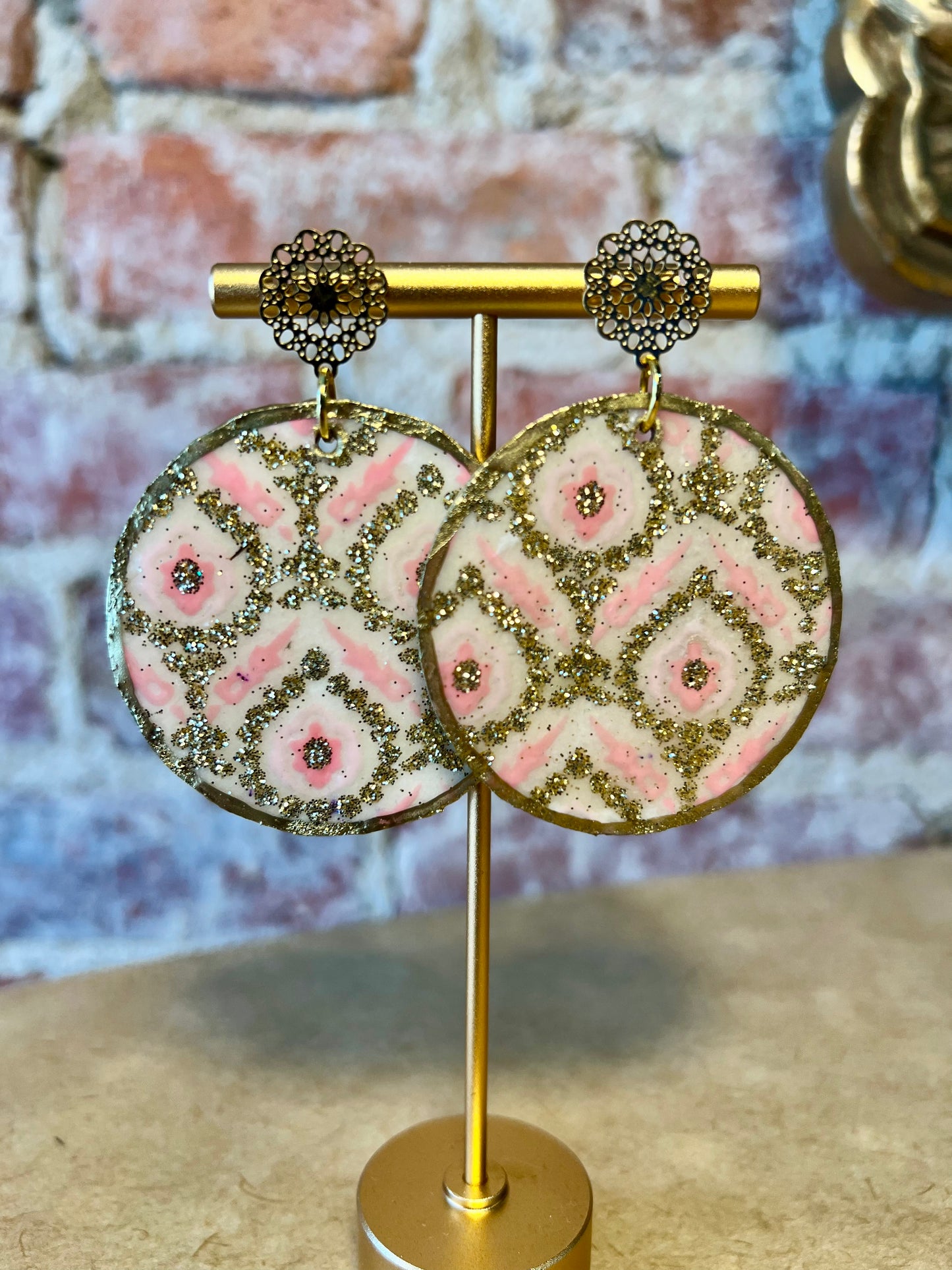 Pink cream and gold shimmer round disc.