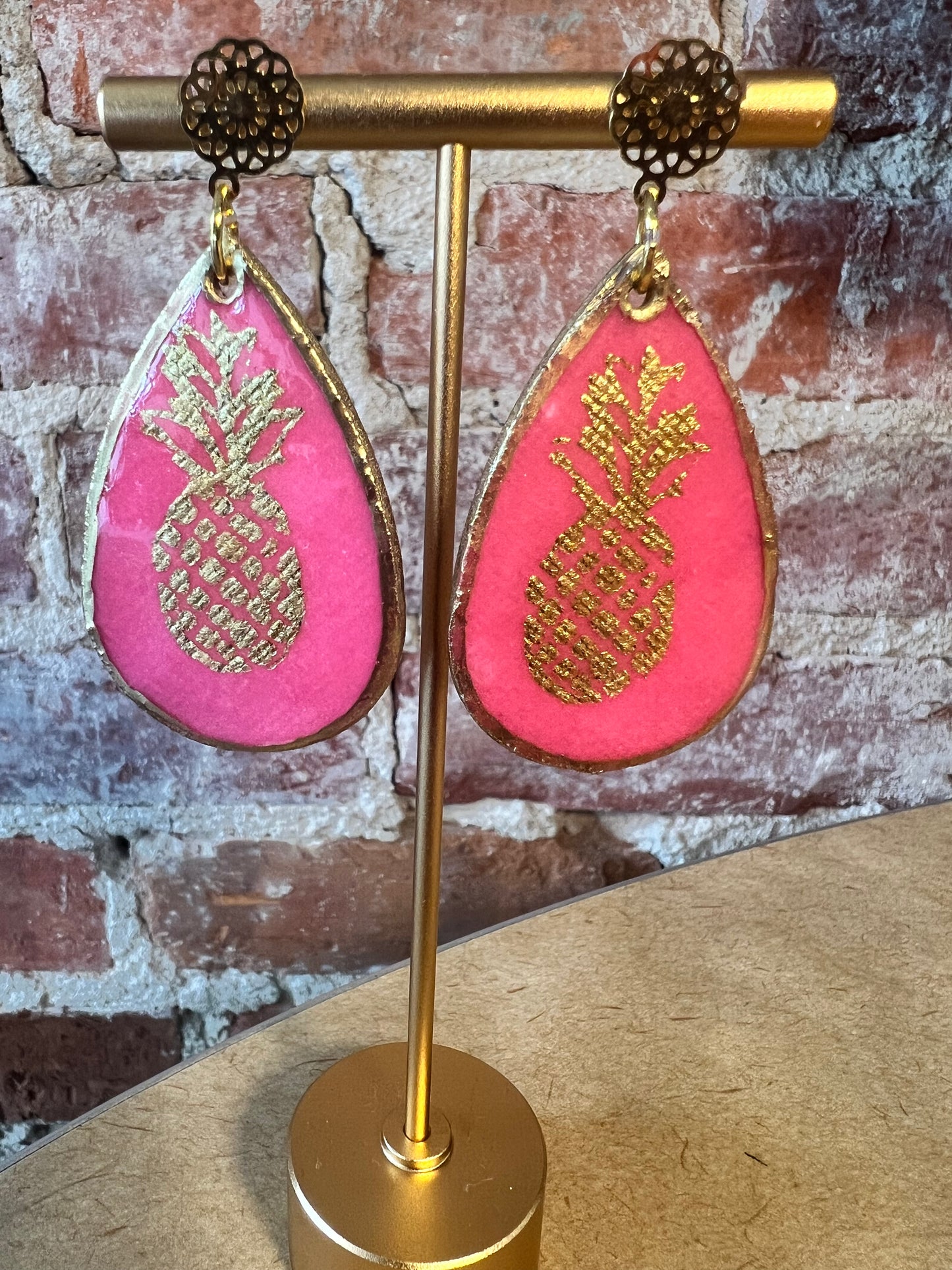 Small teardrop gold and pink pineapple.